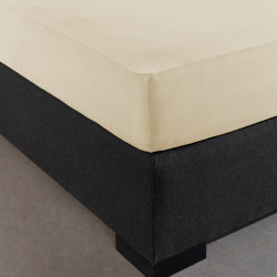 Visuel mis sur le coin du lit drap housse jersey beige