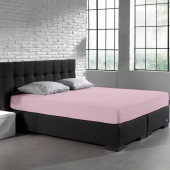Visuel d'ambiance, le drap housse en jersey extensible rose mis sur tout le lit