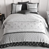 Parure de lit 220x240 Casta avec imprimés graphiques d'éventails noirs sur fond blanc et deux taies d'oreiller assorties.