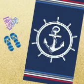 Visuel plage serviette ancre sur fond bleu marine 100% coton tissage jacquard 90x170cm