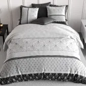 Parure de lit 220x240 Casta avec imprimés graphiques d'éventails noirs sur fond blanc et deux taies d'oreiller assorties.